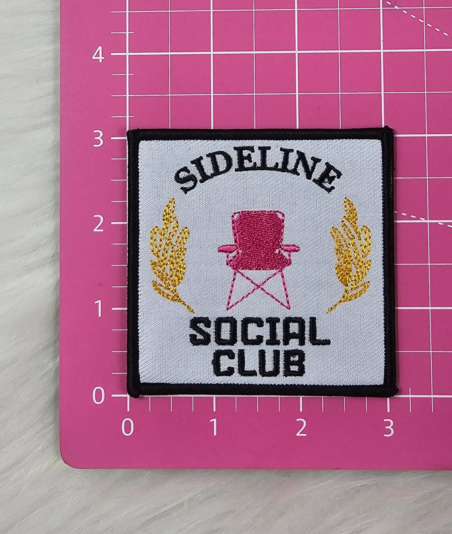 Patch: 'Sideline Social Club' Pink Chair Woven Embroidery Iron On